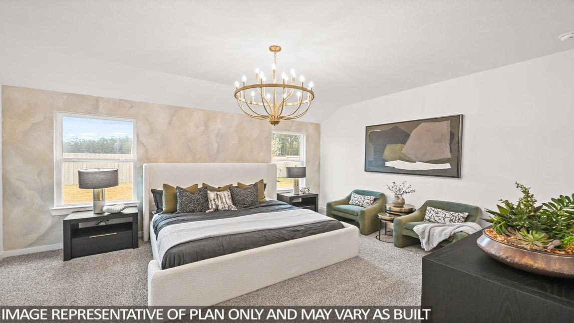 Primary bedroom with carpet flooring