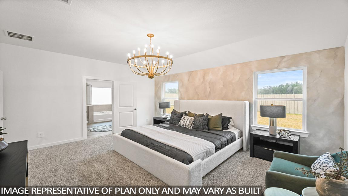 Primary bedroom with carpet flooring