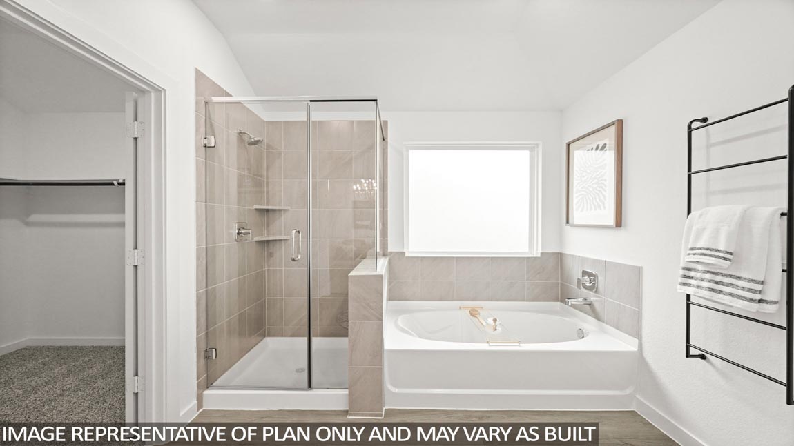 Primary bathroom with tub and shower
