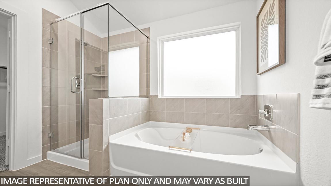 Primary bathroom with tub and shower