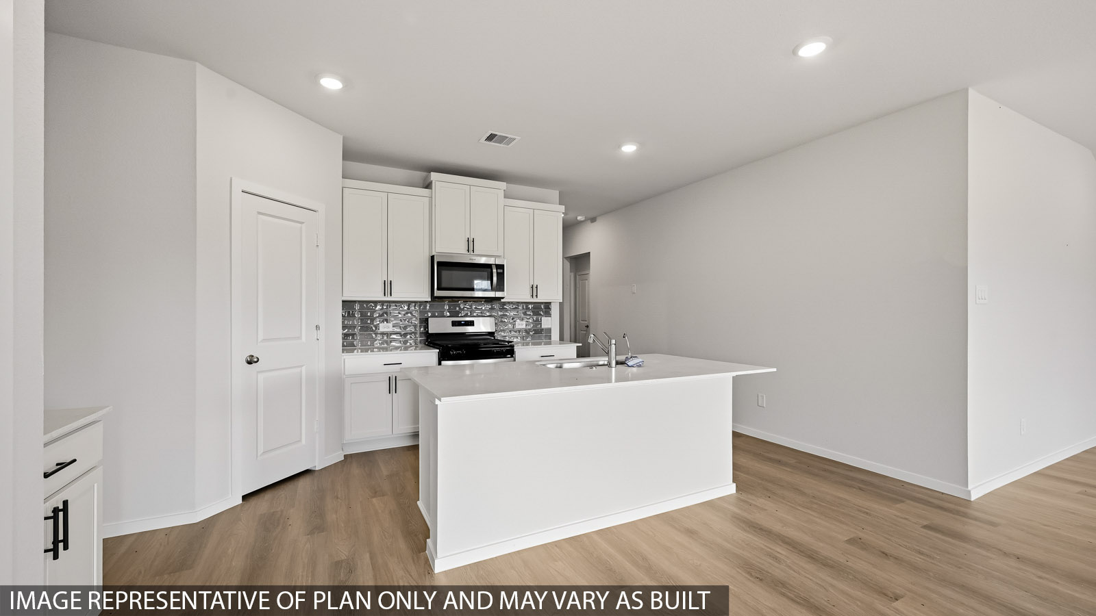 Kitchen with an island and vinyl floor