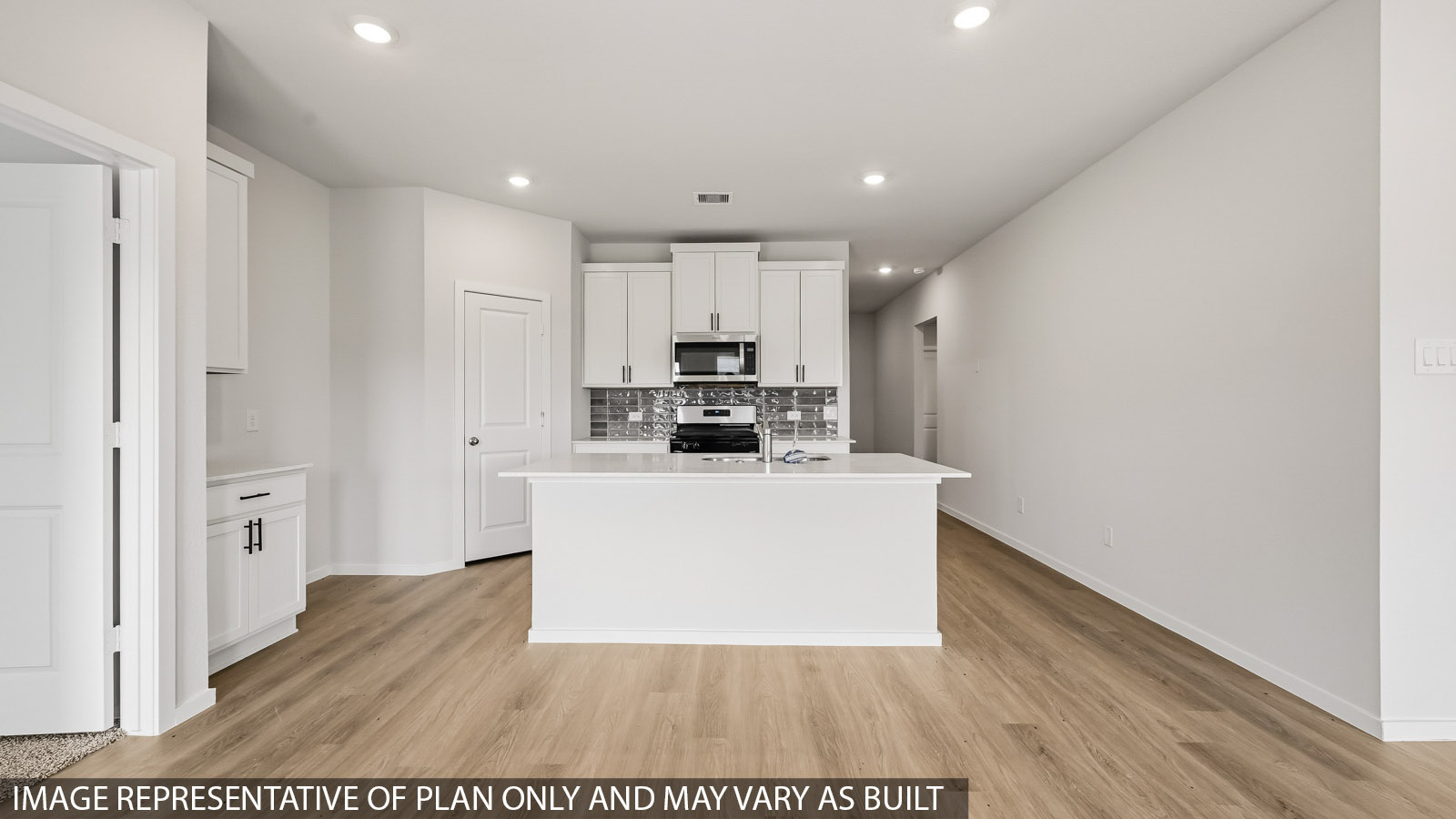 Kitchen with an island and vinyl floor