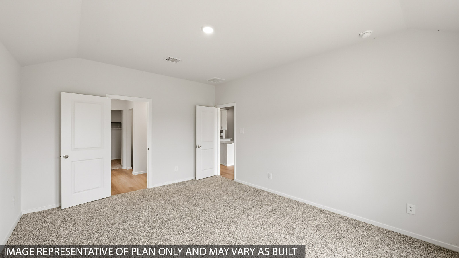 Primary bedroom with bright windows