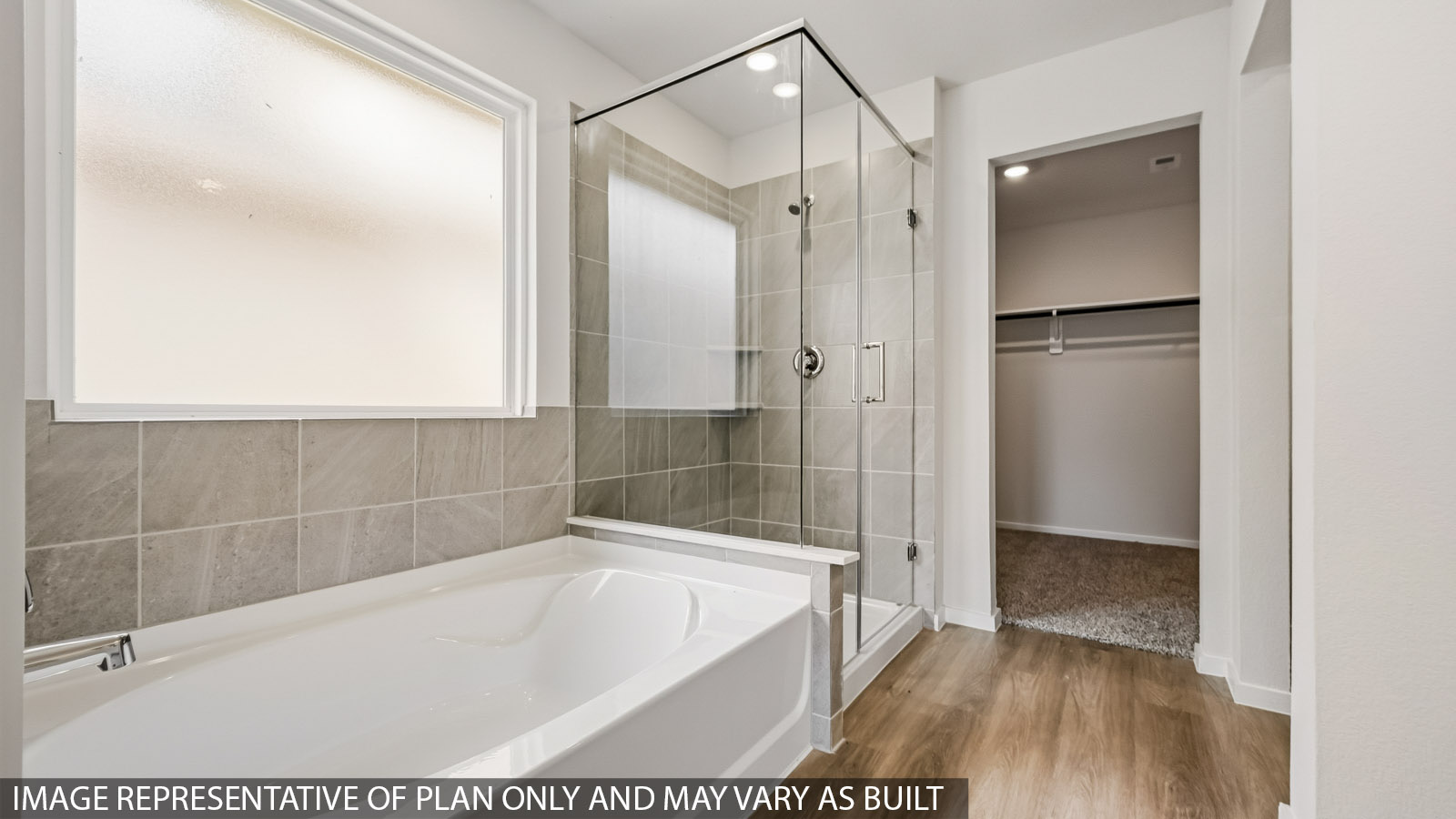 Primary bathroom with tub and shower