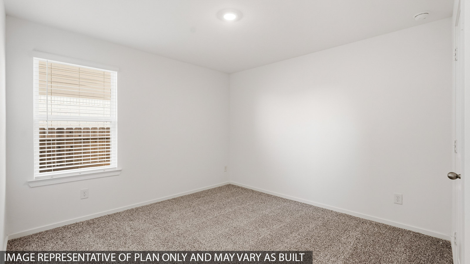 secondary bedroom with carpet flooring
