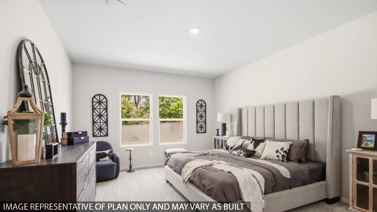 Primary bedroom with carpet flooring