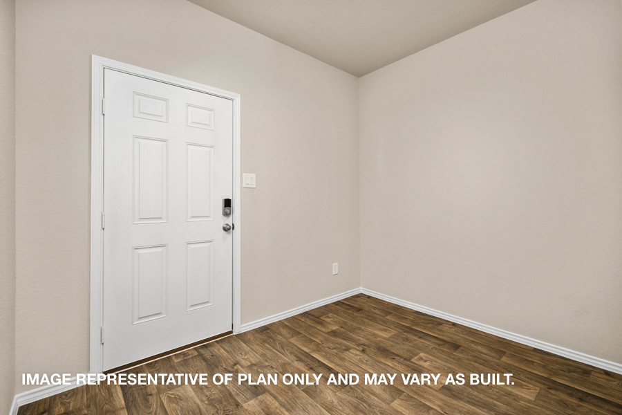 Entryway with vinyl flooring.