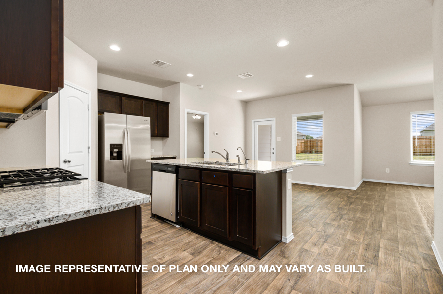 Kitchen with island and stainless-steel appliances.
