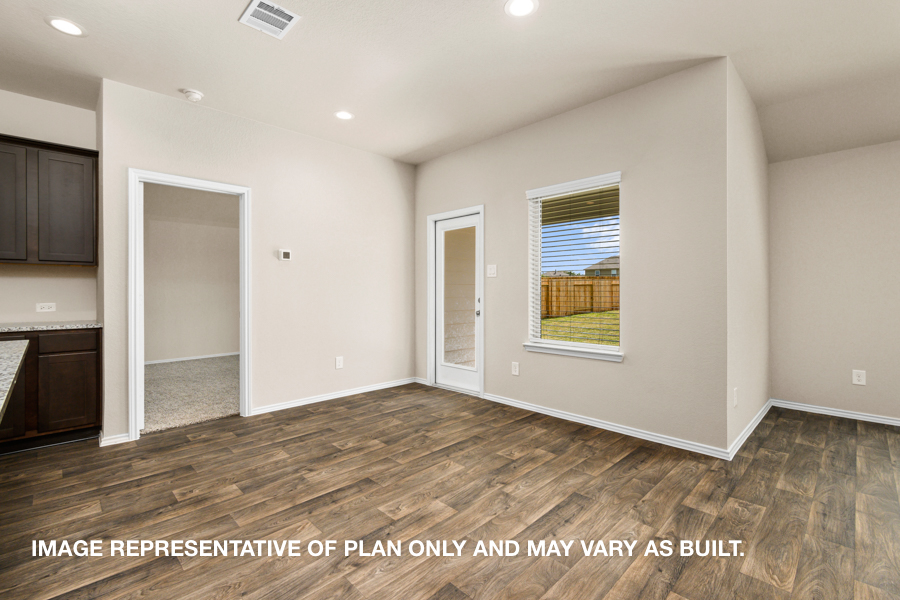 Open concept living and dining space with vinyl flooring.