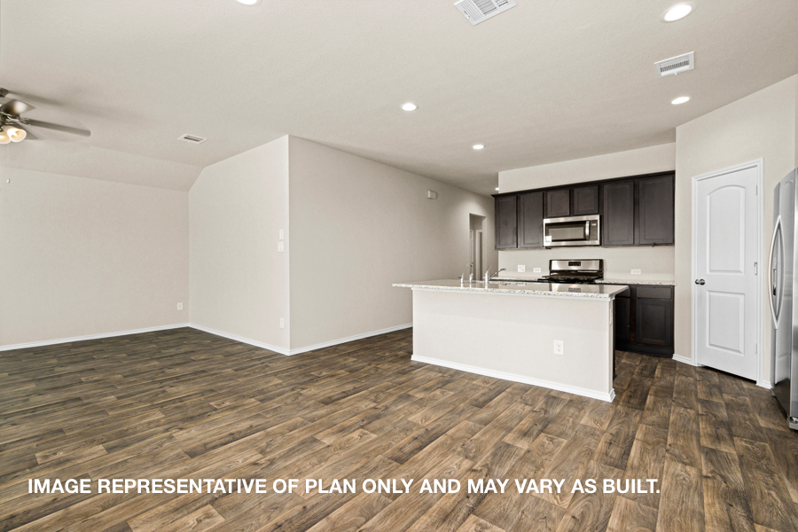 Open concept living and dining space with vinyl flooring.