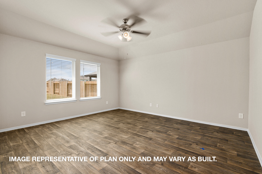 Open concept living and dining space with vinyl flooring.