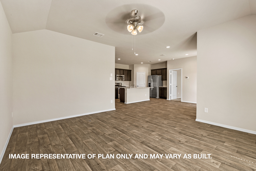 Open concept living and dining space with vinyl flooring.