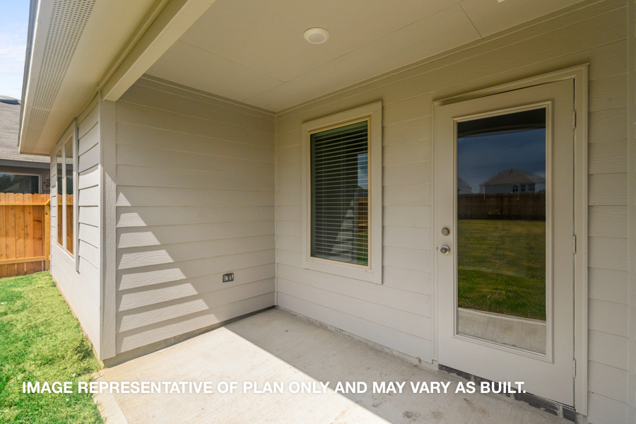 Landscaped backyard with patio.