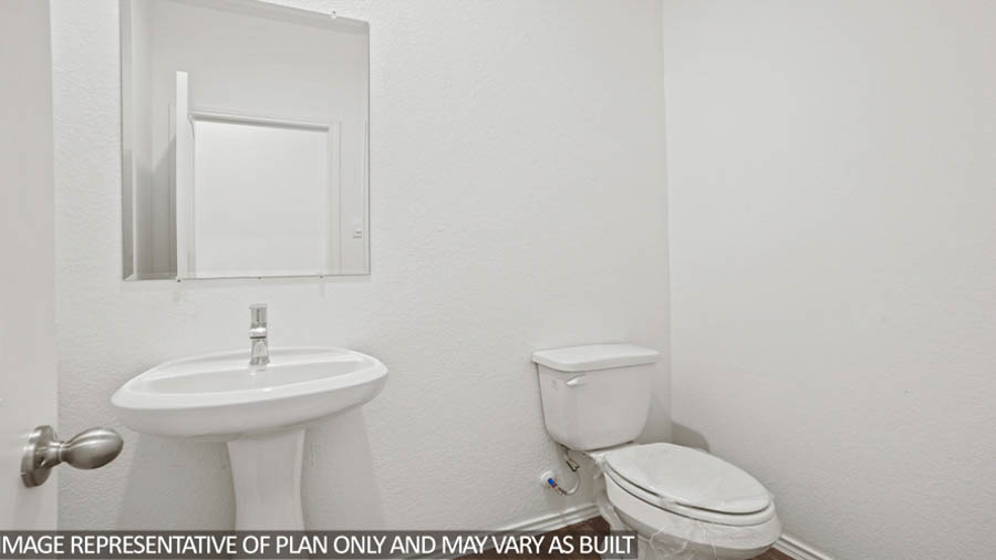 Powder room with pedestal sink and vinyl flooring.