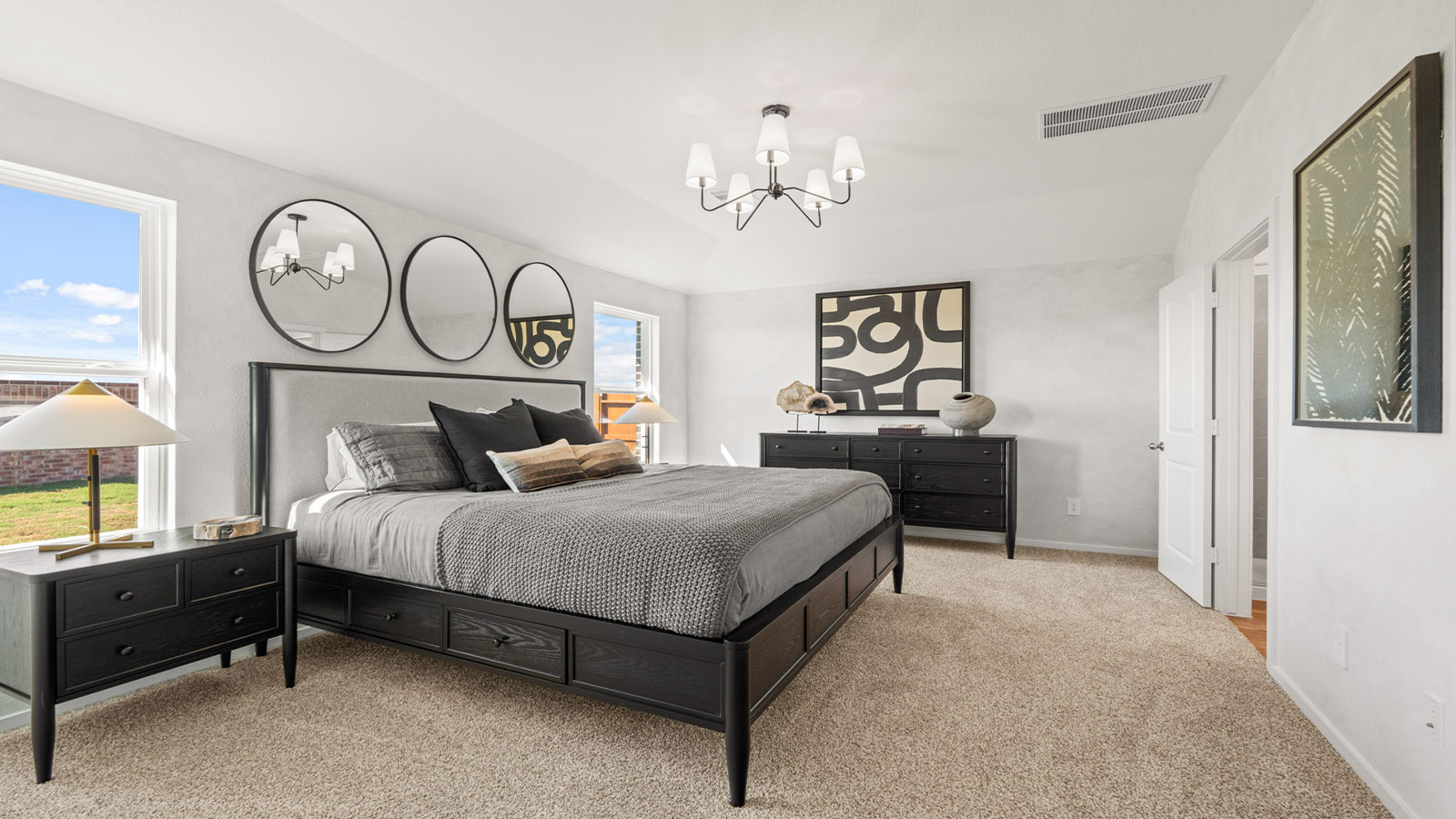 Primary bedroom with carpet flooring