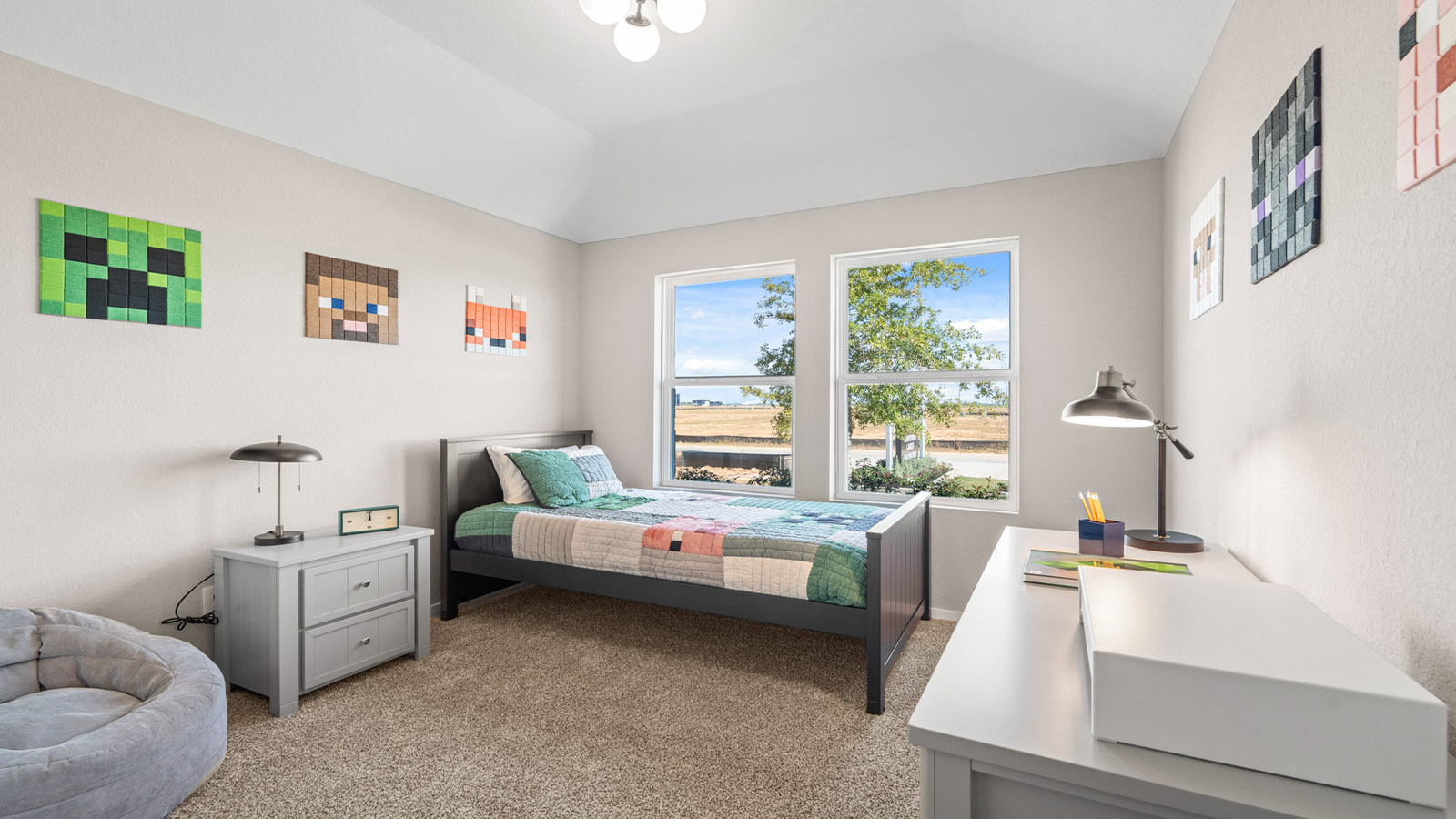 Secondary bedroom with carpet flooring