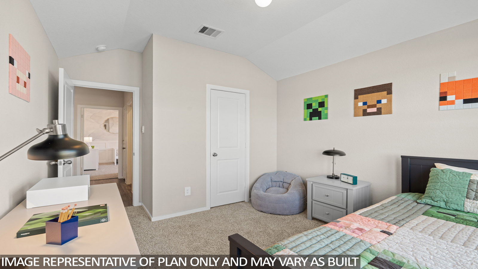 Secondary bedroom with carpet flooring