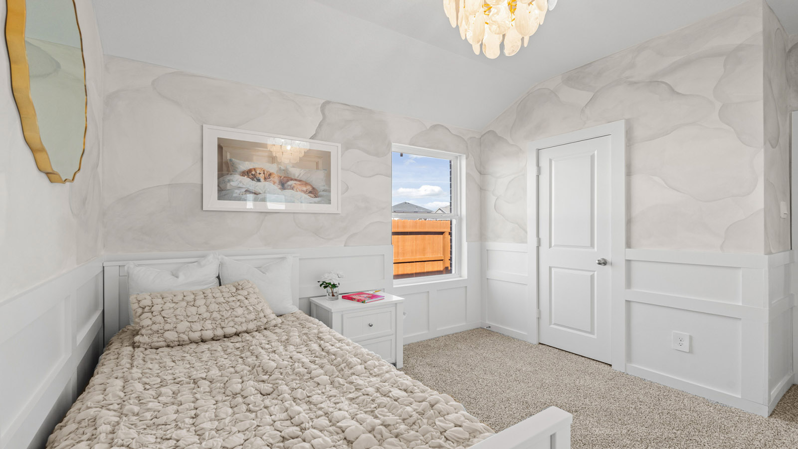 Secondary bedroom with carpet flooring