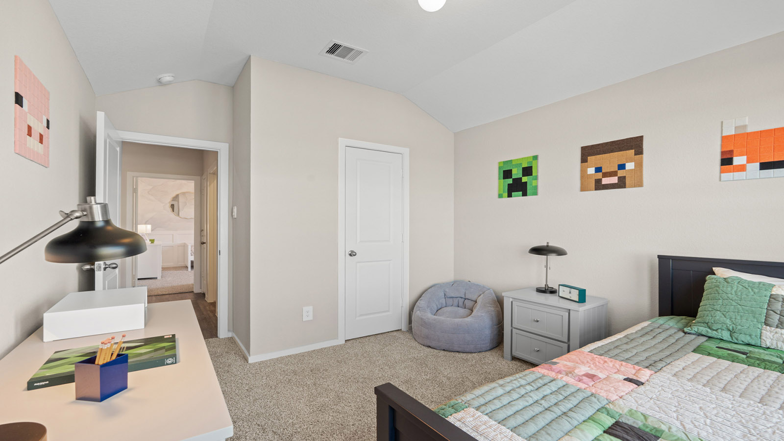Secondary bedroom with carpet flooring