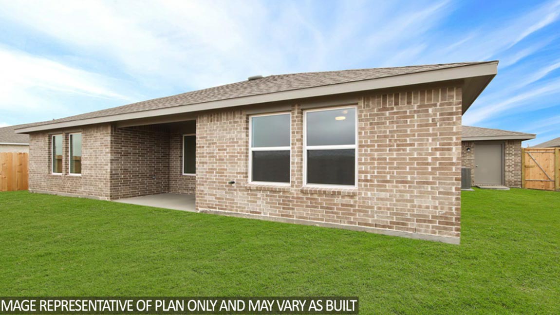 Landscaped backyard with patio.