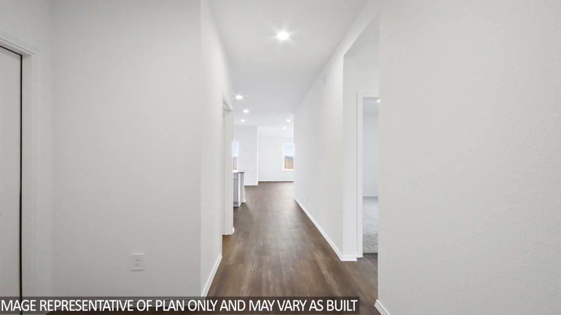 Entryway with vinyl flooring.