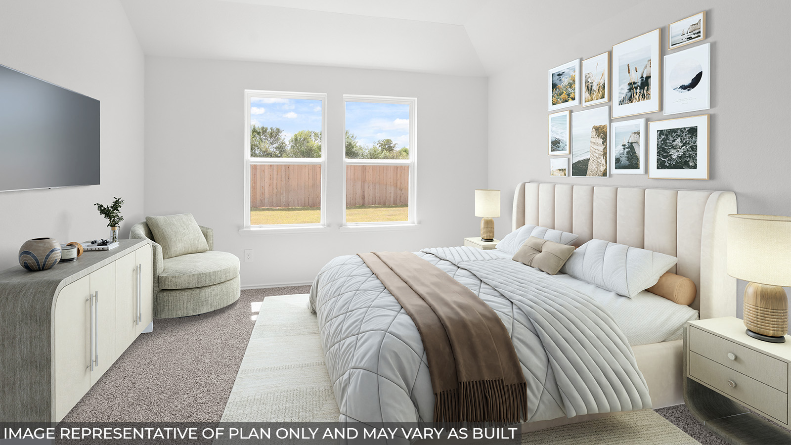 Staged primary bedroom with carpet flooring and bright windows.