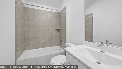Secondary bathroom with a single sink, and tub.