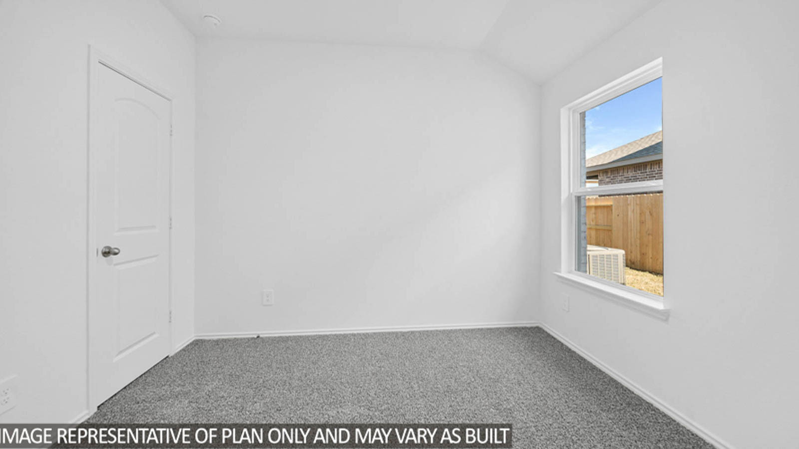 Secondary bedroom with carpet flooring, a bright window, and a tall closet.