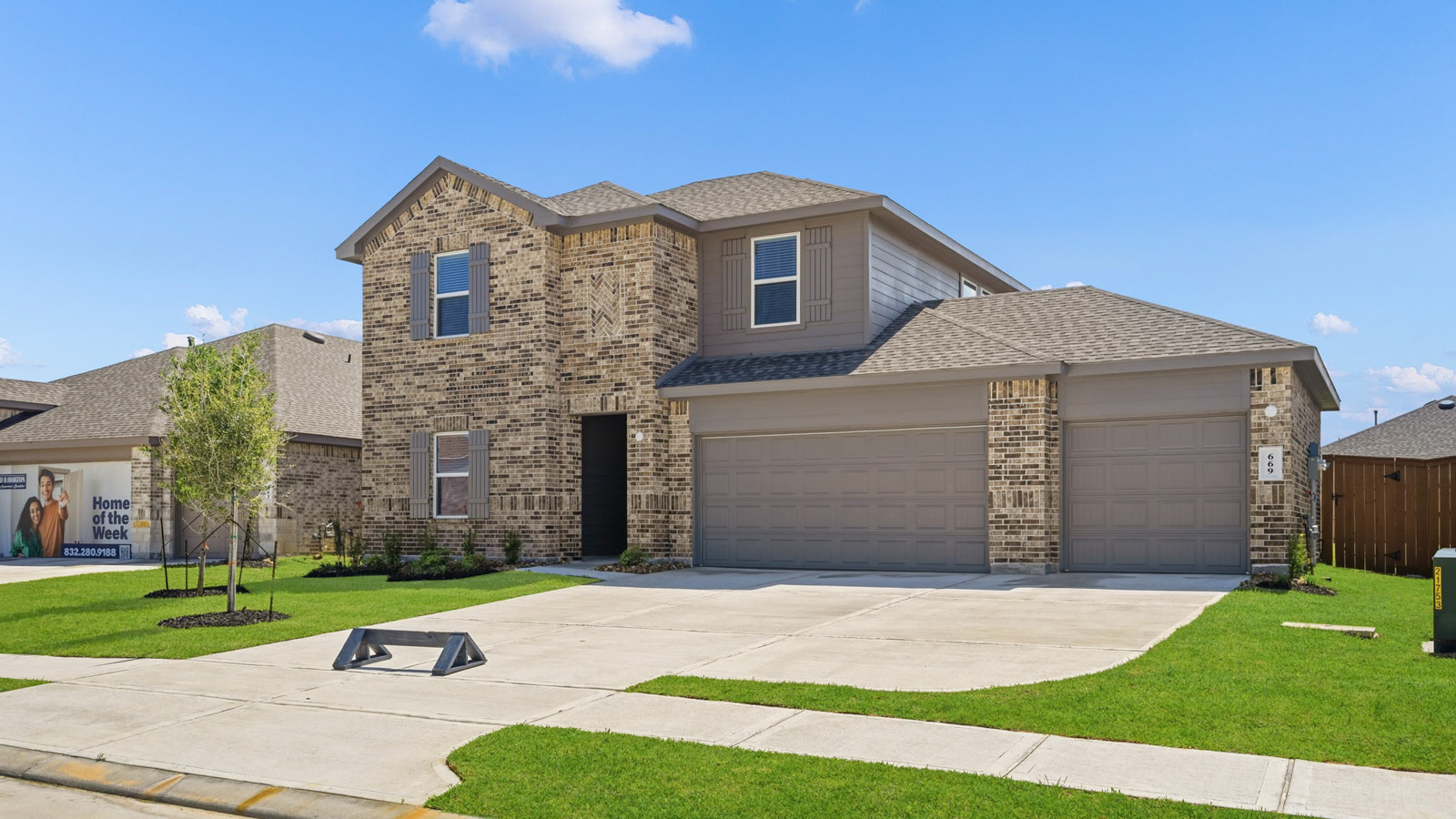 Two story home with three car garage