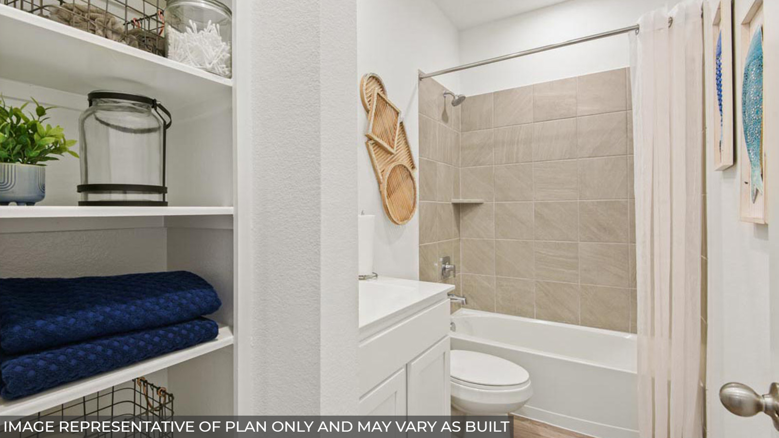 Secondary bathroom with a linen nook and a tile tub/shower combo.