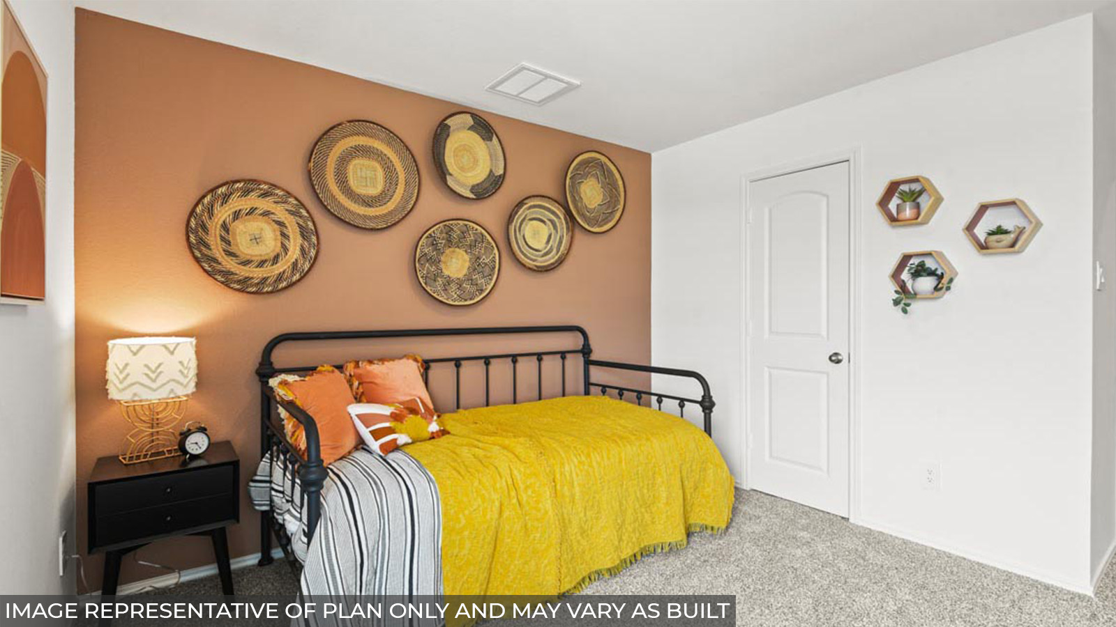 Secondary bedroom with carpet flooring