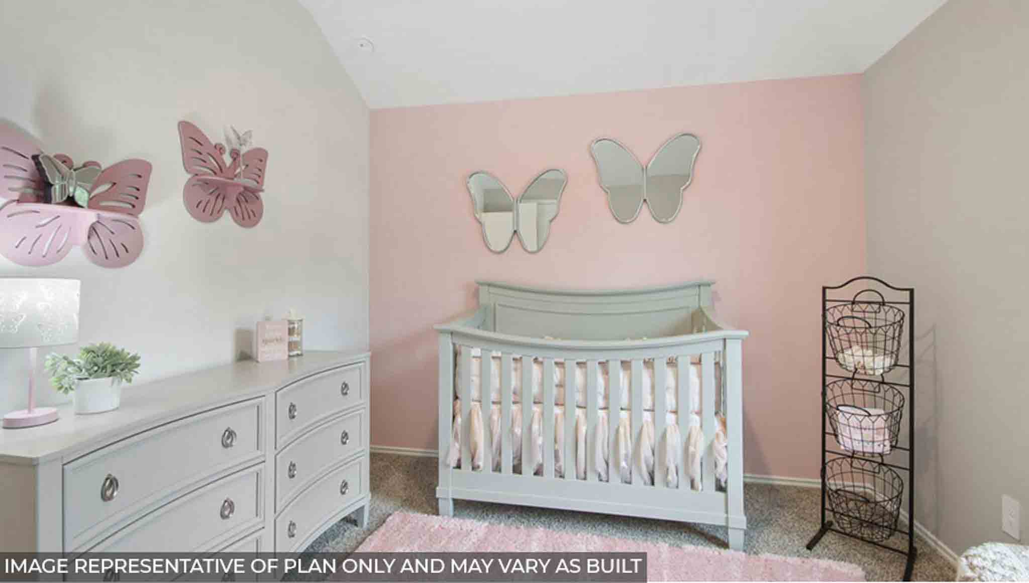 Secondary bedroom with carpet flooring.