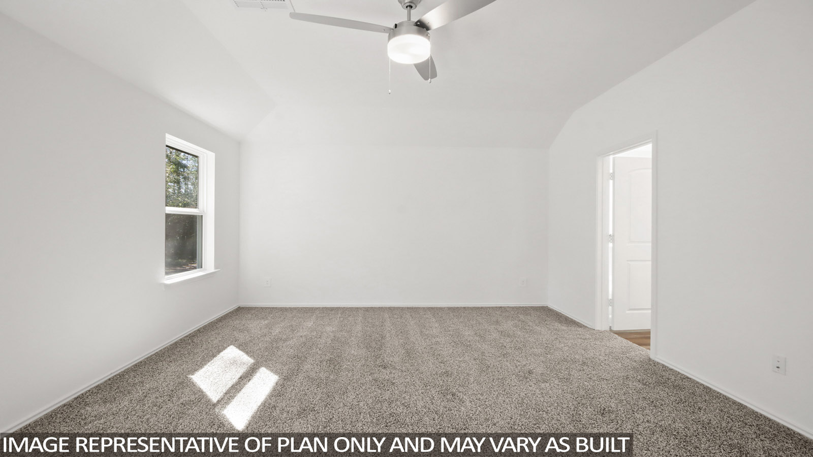Primary bedroom with carpet flooring