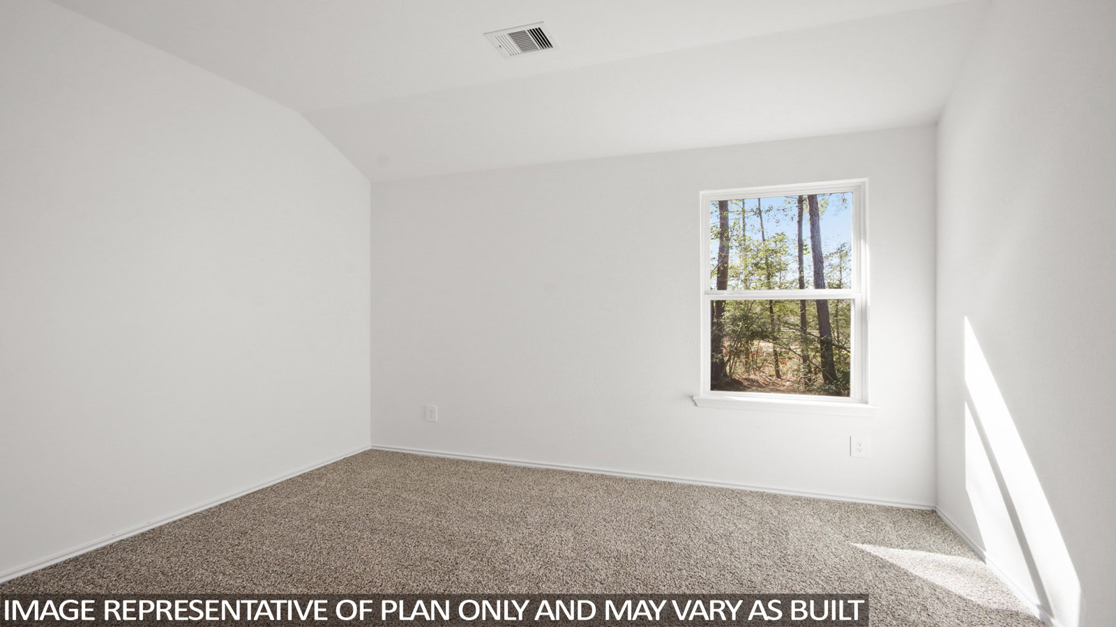 Secondary bedroom with carpet flooring