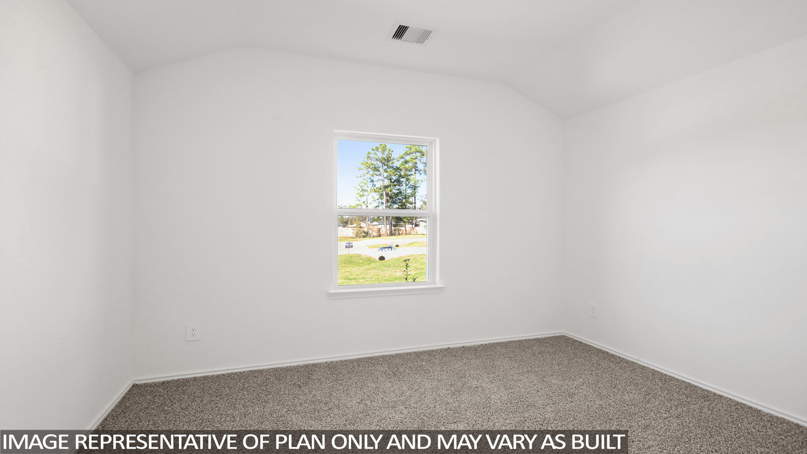 Secondary bedroom with carpet flooring