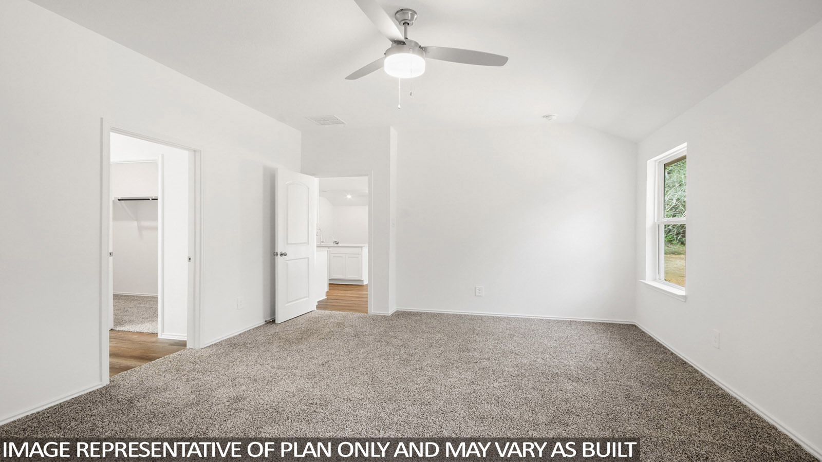 Primary bedroom with bright windows