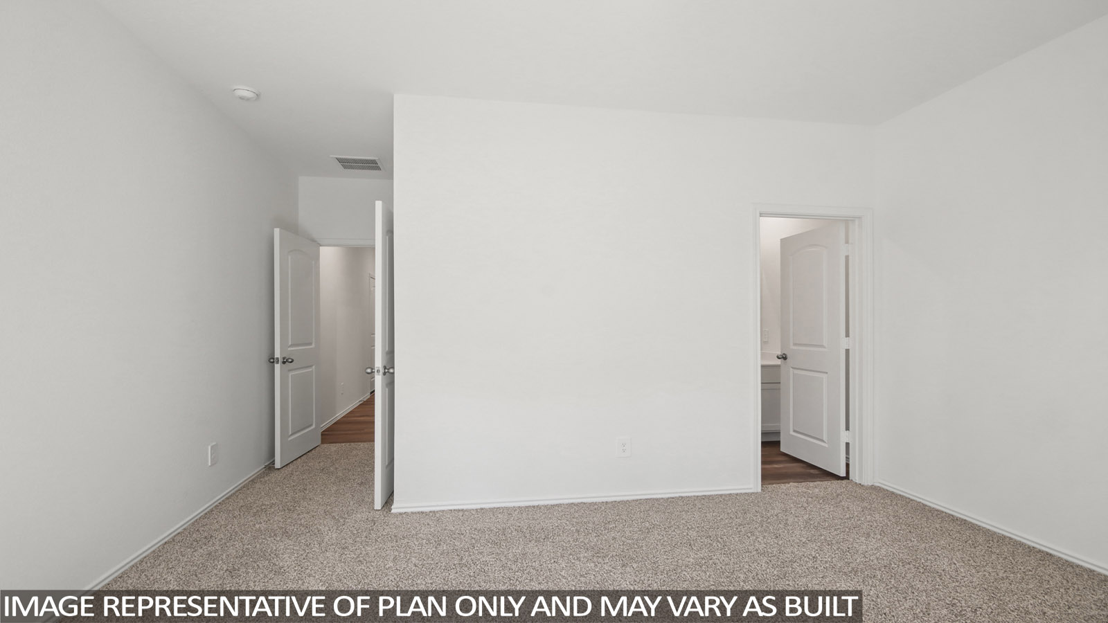 Secondary bedroom with carpet flooring