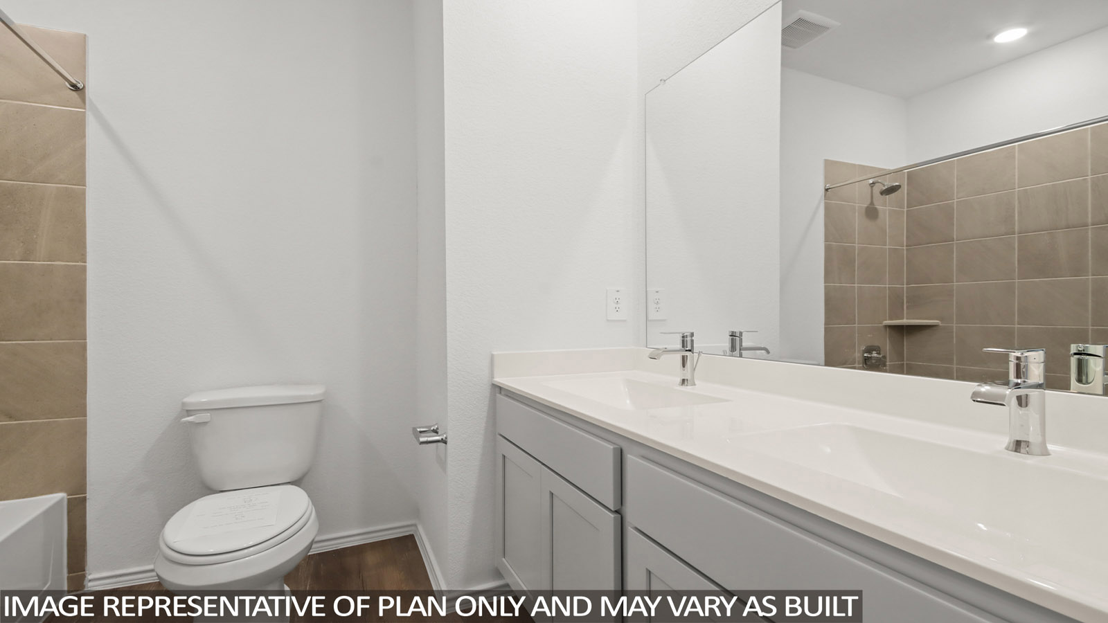 Secondary bathroom with a double sink and a tile tub/shower combo.