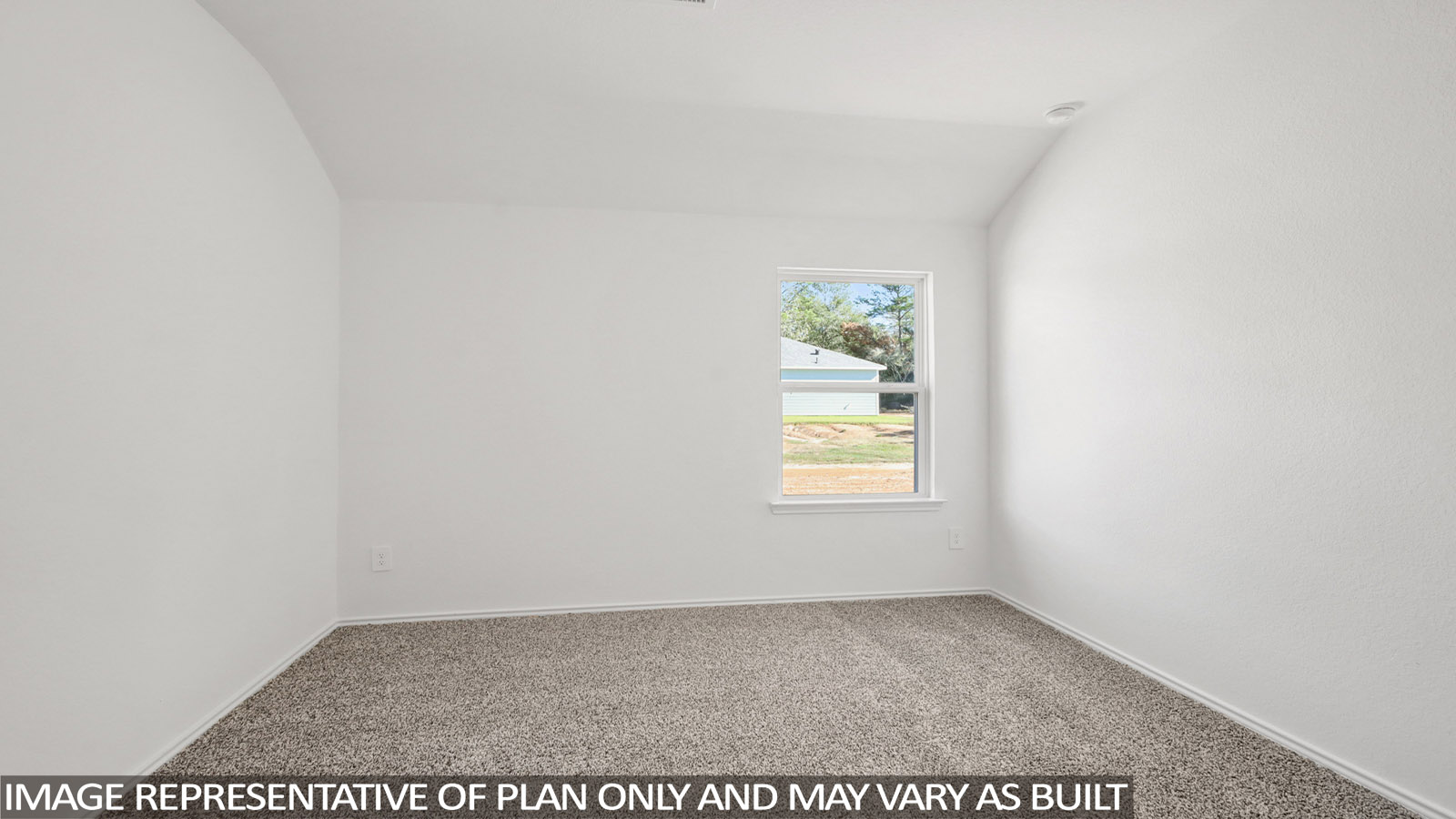Secondary bedroom with carpet flooring