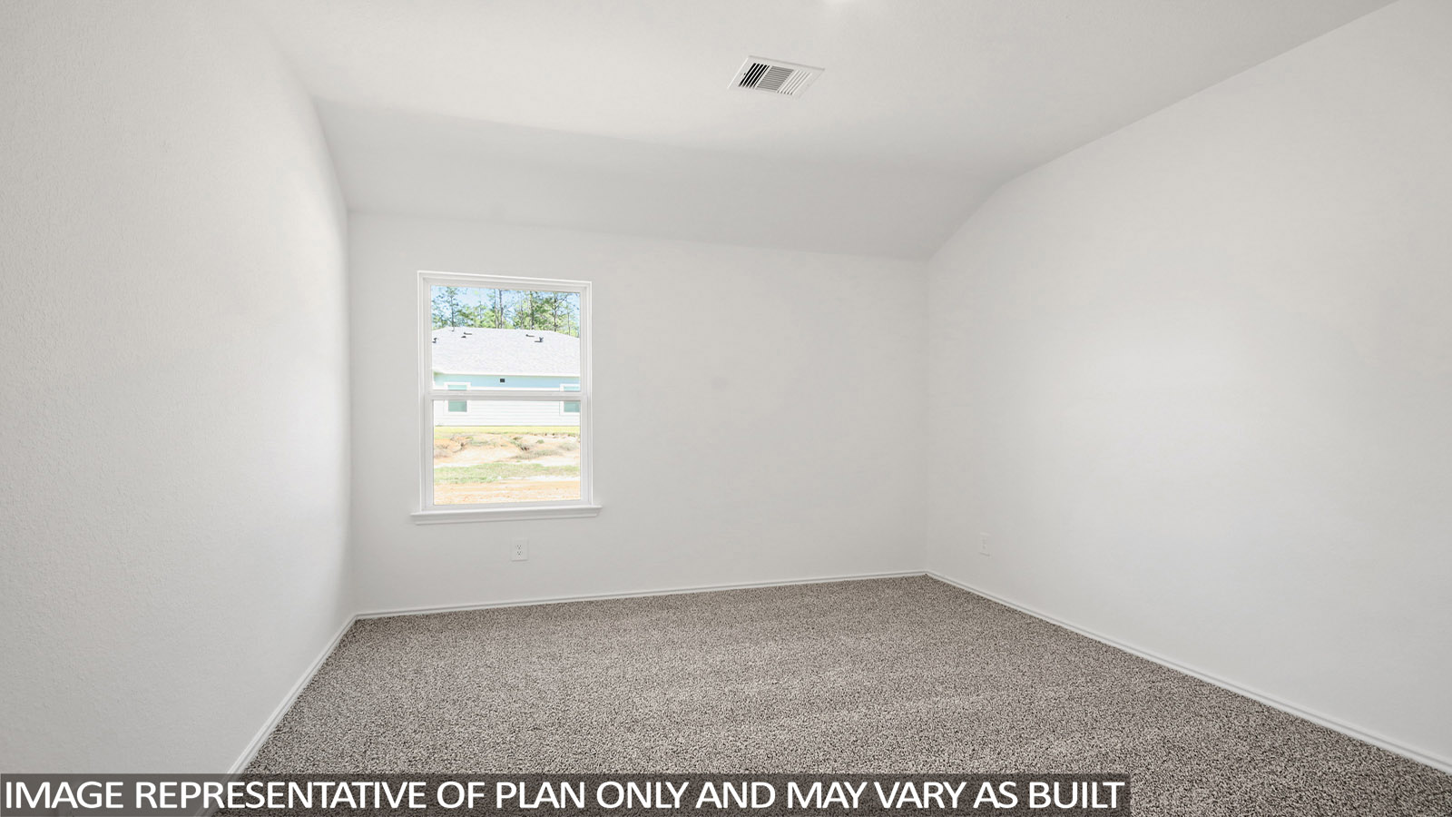 Secondary bedroom with carpet flooring