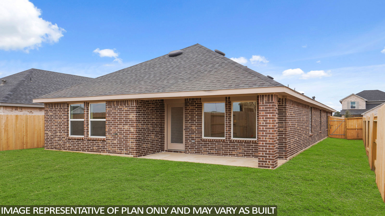 Spacious backyard with patio and overhead light.