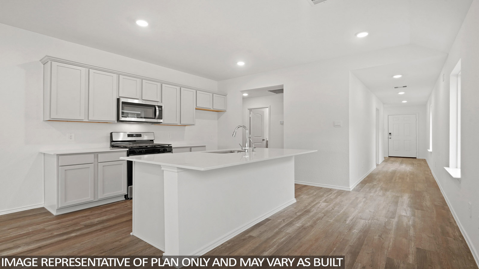 Kitchen with island and stainless-steel appliances.