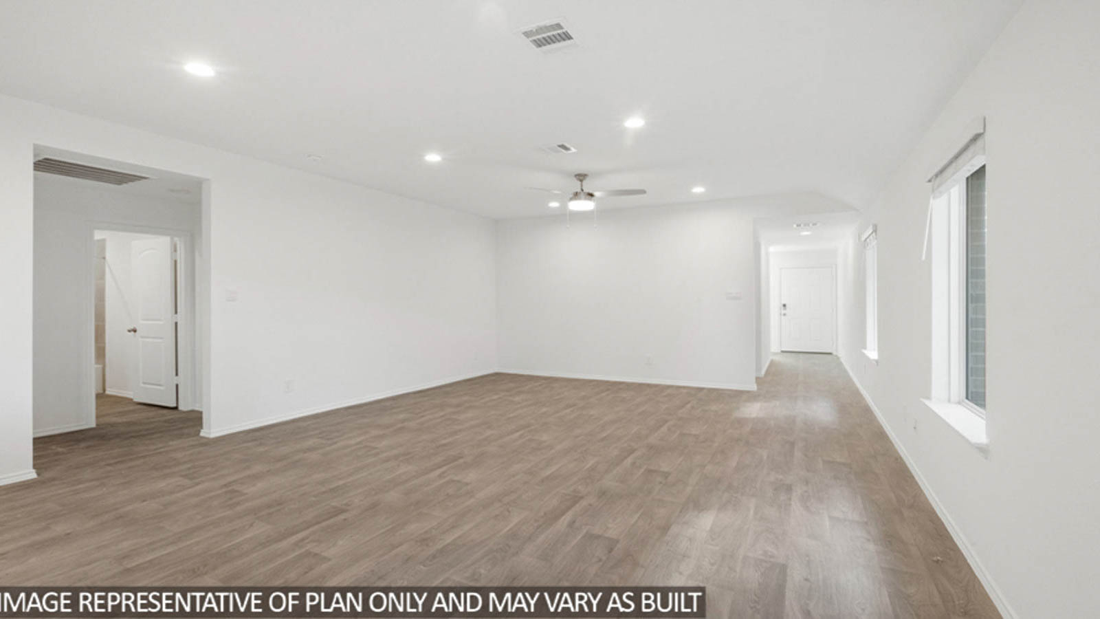Open concept living and dining space with vinyl flooring.
