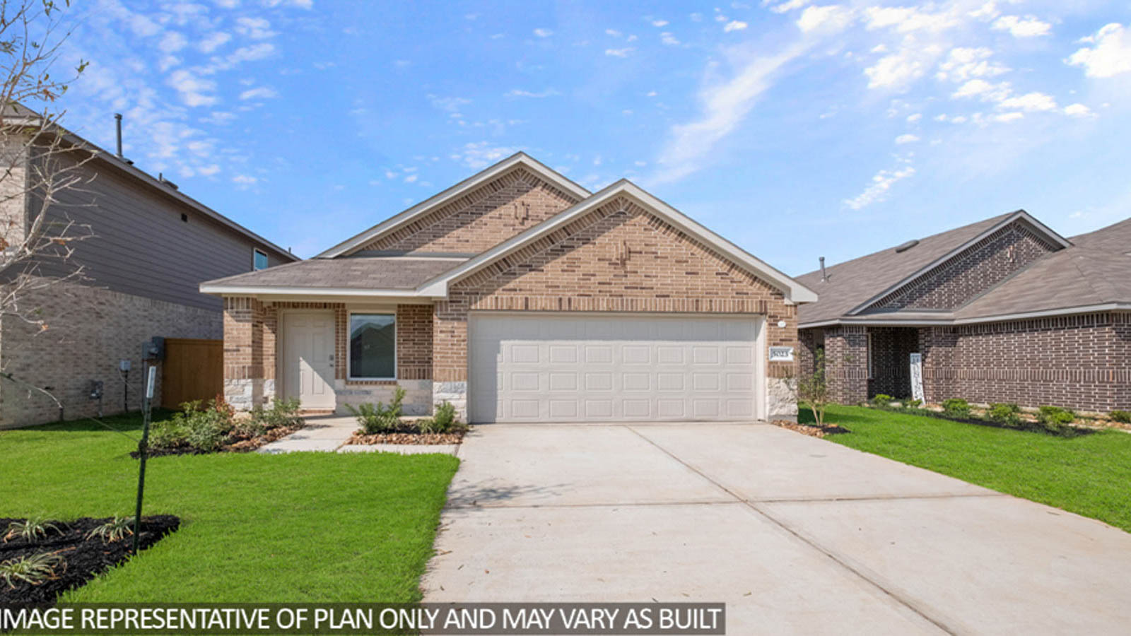 Single-story home with tan trimming and a two-car garage.