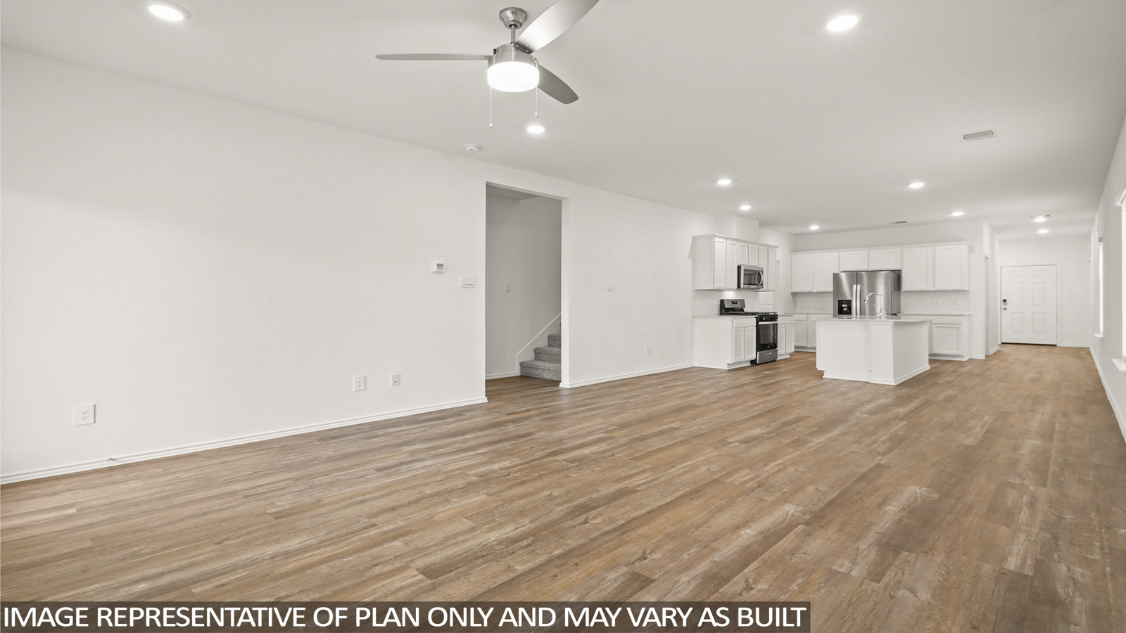 Open concept living and dining room with vinyl flooring and bright windows.