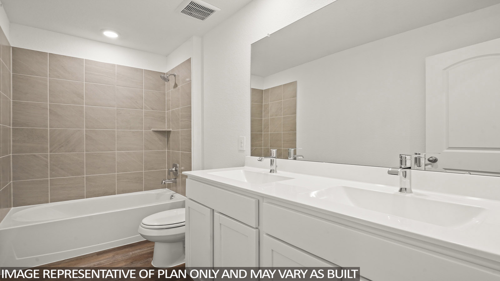 Secondary bathroom with a tile tub/shower combo and a double sink.