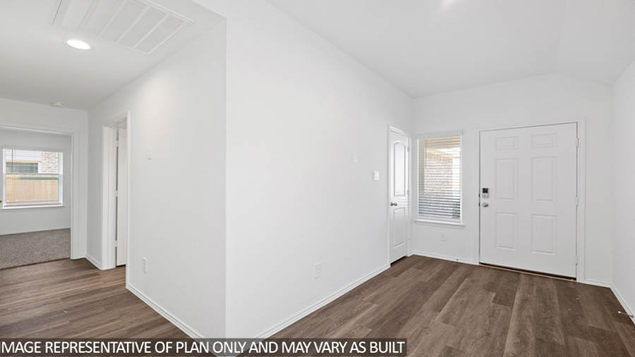 Entryway and foyer with vinyl flooring.