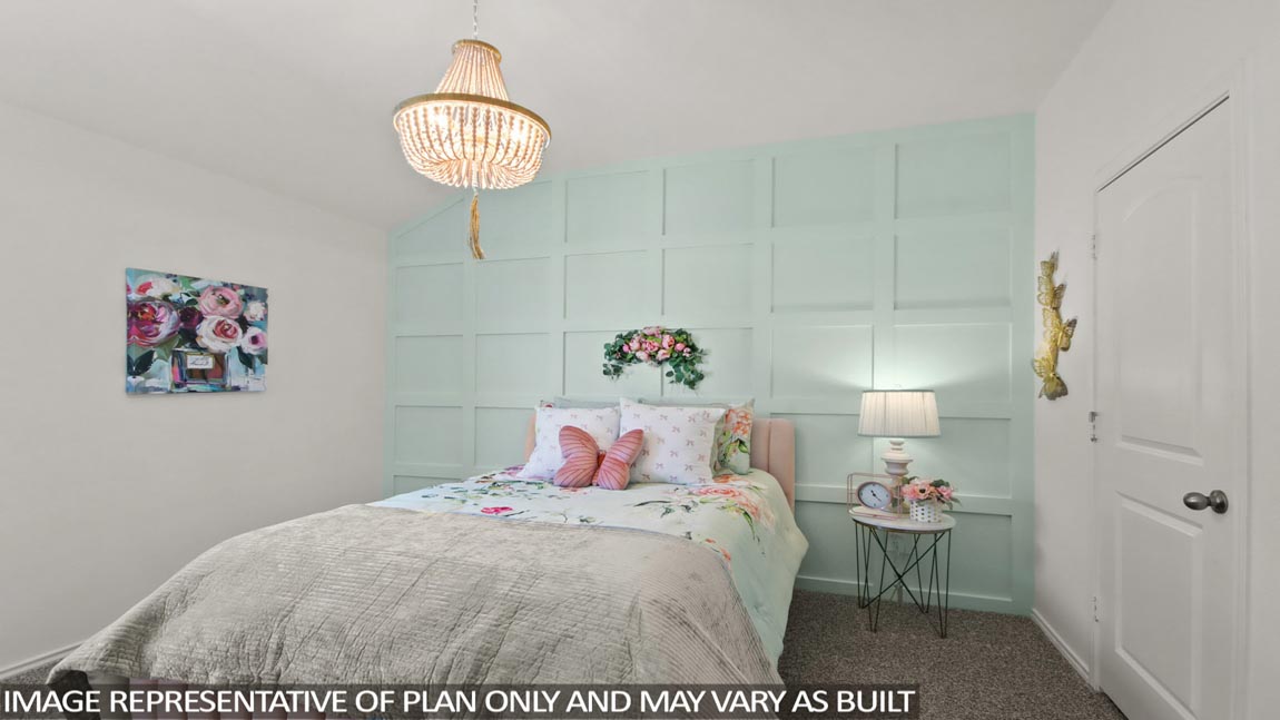 Secondary bedroom with carpet flooring and a bright window.