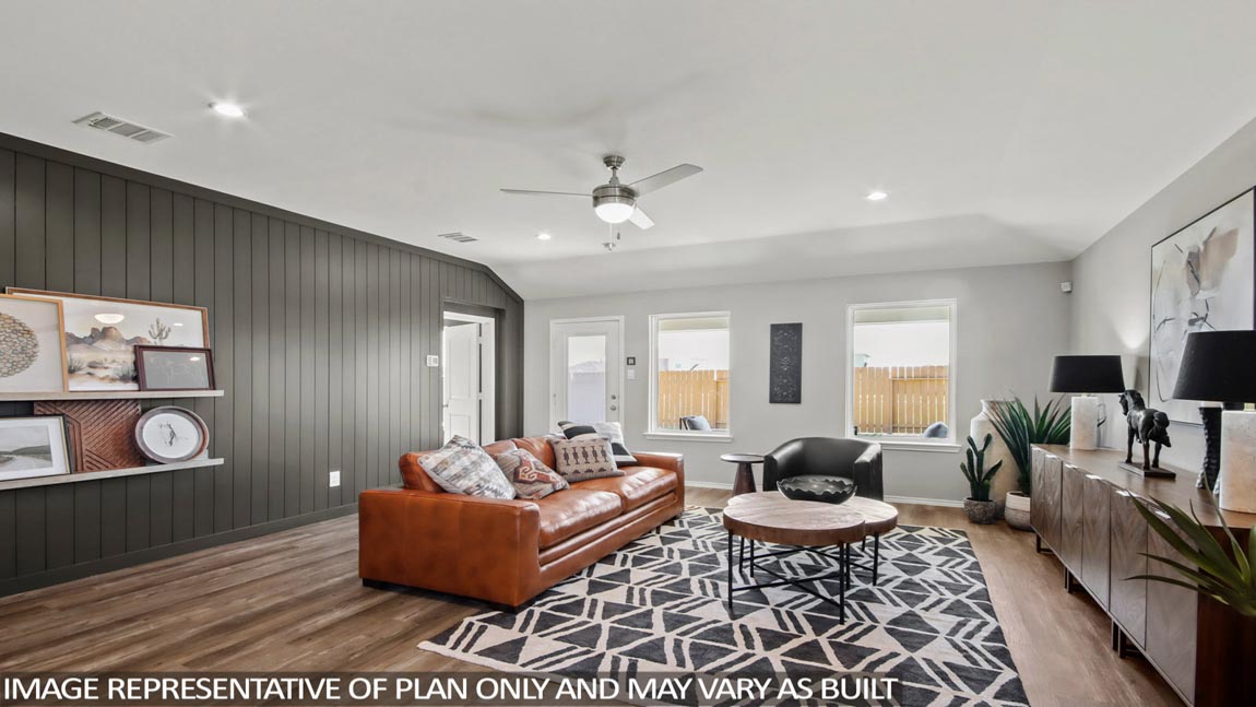 Open concept living and dining area with vinyl flooring and bright windows.