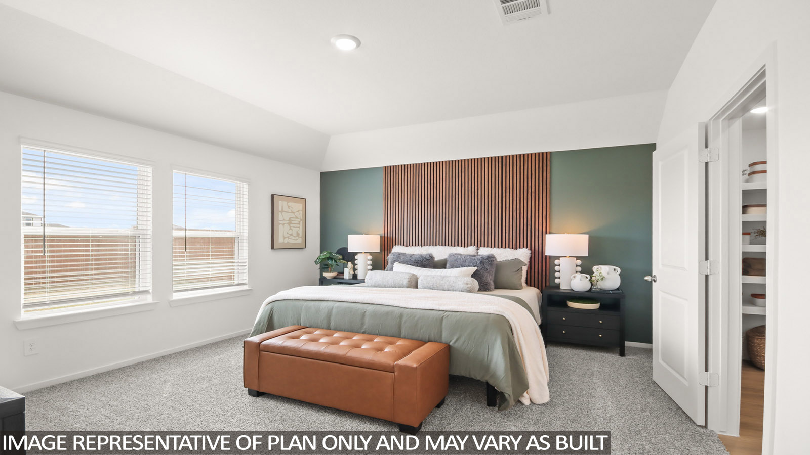 primary bedroom with carpet flooring